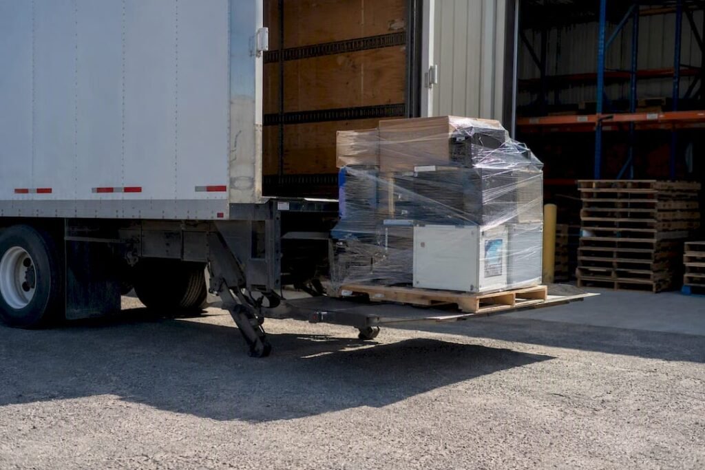 Truck lowering pallet using liftgate